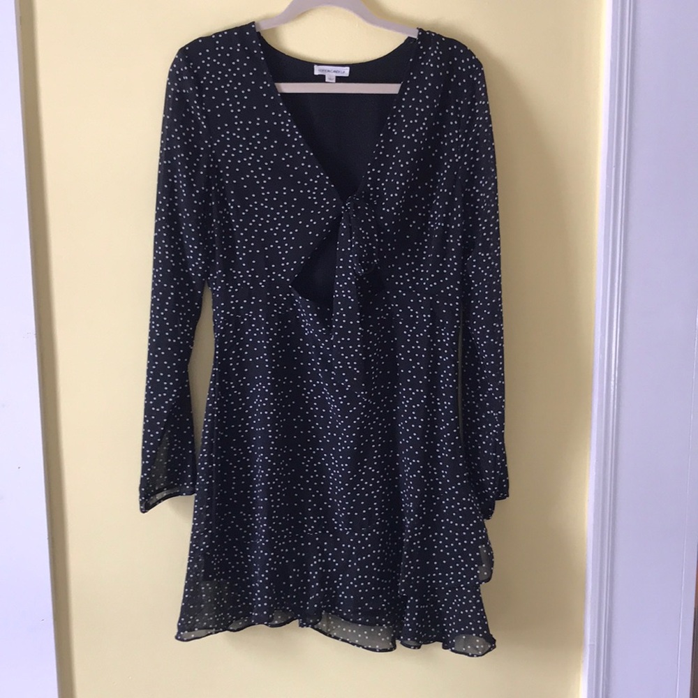 Black polkadot mini dress. Ties in the front.